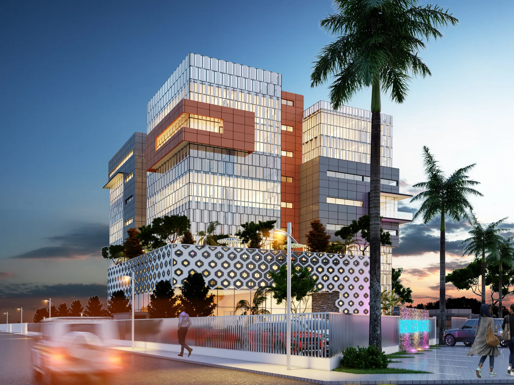 Immeuble de bureaux aux façades vitrées et cuivrées, éclairé au crépuscule