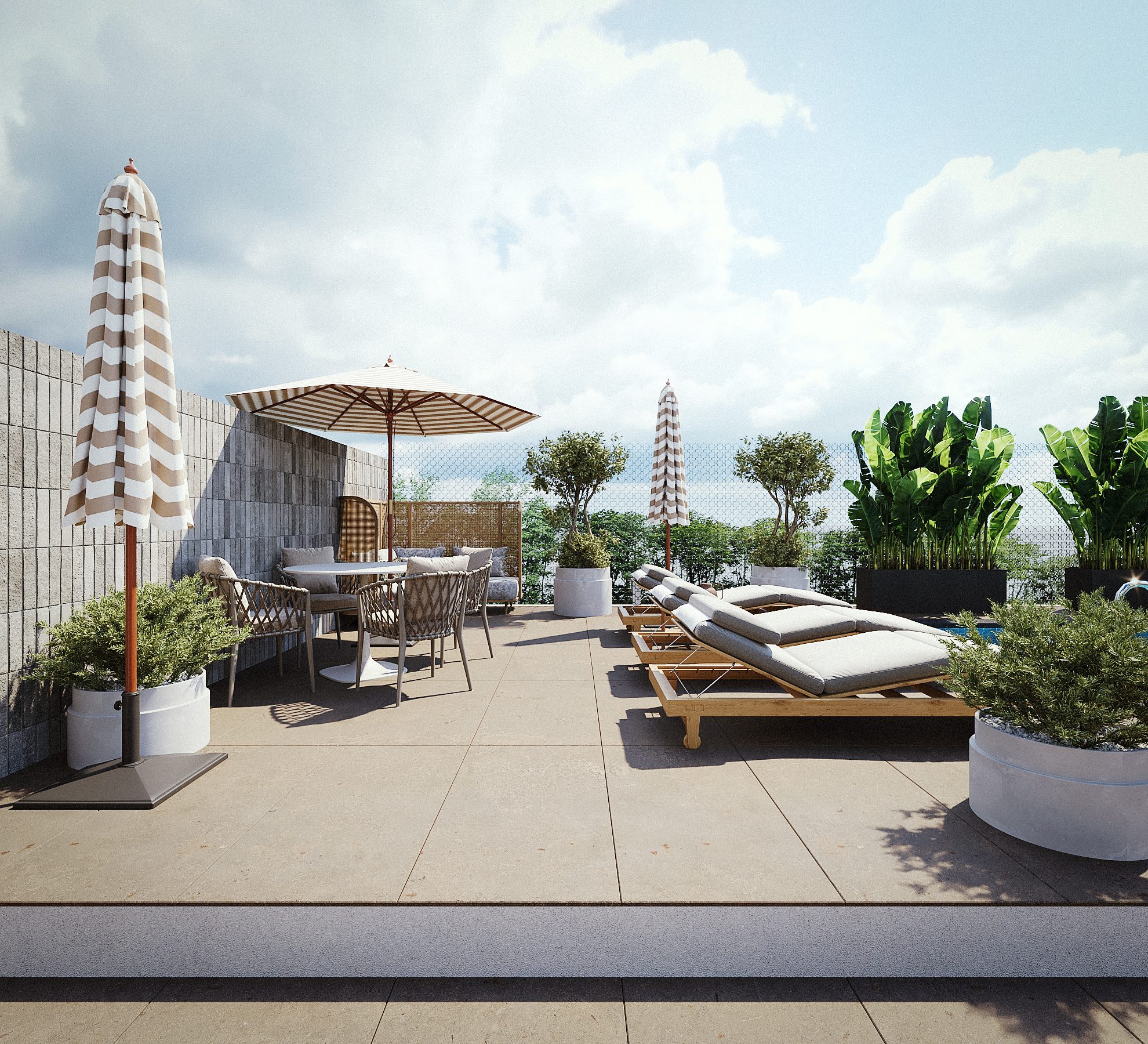 Complexe immobilier à Abidjan — terrasse en toiture avec salon extérieur et parasols
